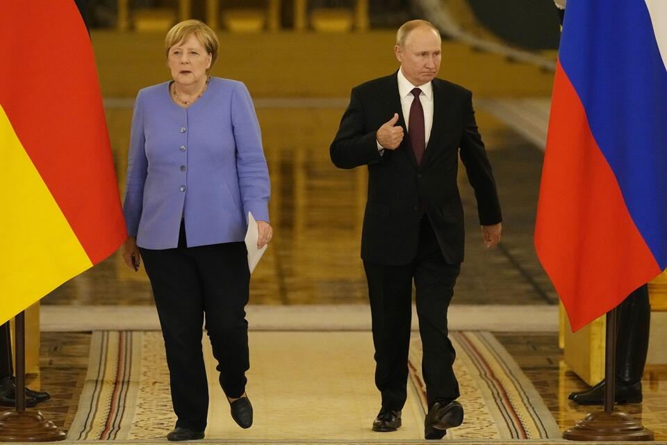 A. Merkel, W. Putin / autor: PAP/EPA