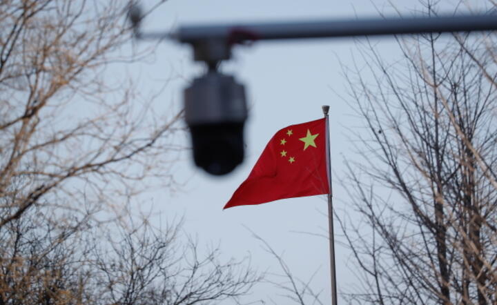 Flaga Chin na ulicach Pekinu / autor: EPA/MARK R. CRISTINO 