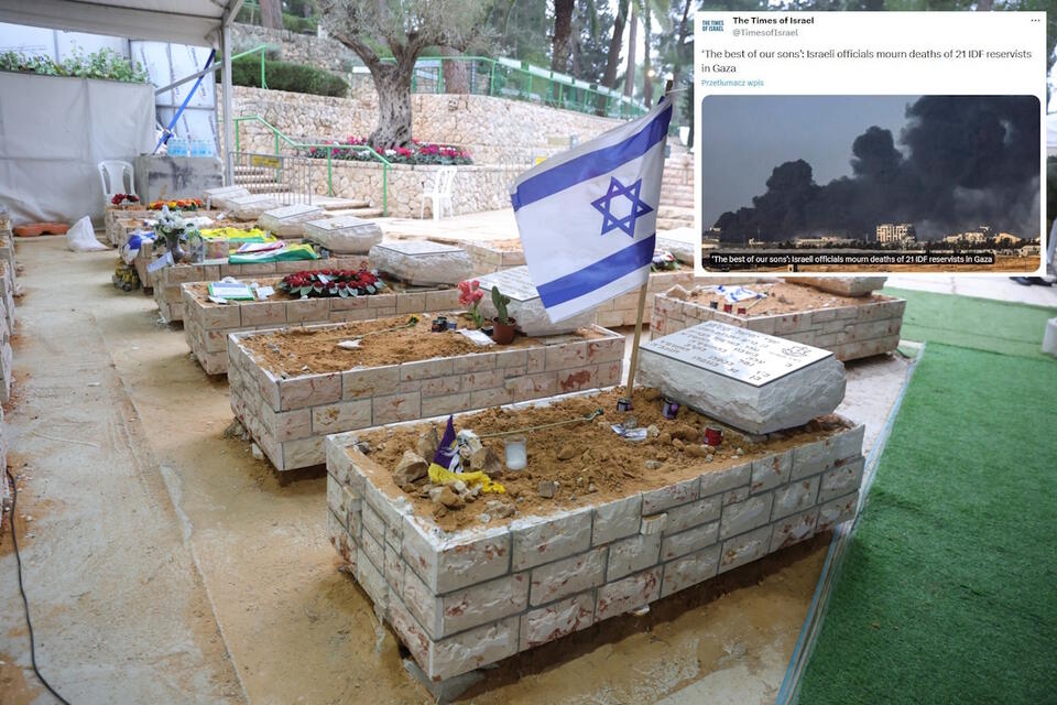 Izraelska flaga zostaje umieszczona na grobie jednego z poległych żołnierzy / autor: PAP/EPA/ABIR SULTAN