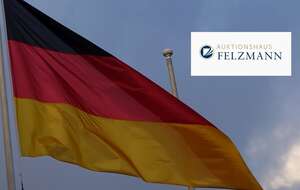 Logo Domu Aukcyjnego Felzmann na tle niemieckiej flagi / autor: Fratria/felzmann.de